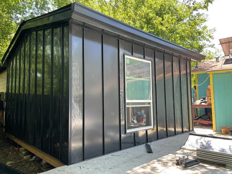 Black standing seam metal wall panels for Metal Roof Installation in Guymon